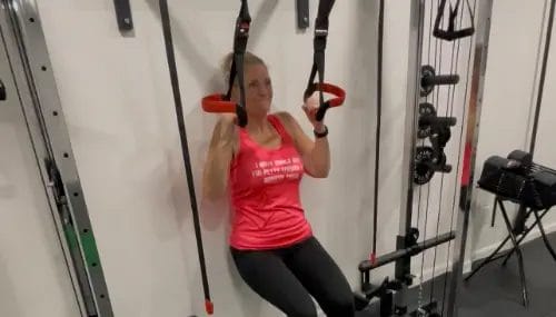 Client doing assisted pull exercise on training machine at FIT40 Personal Training