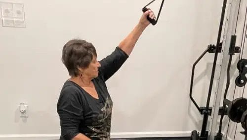 Client using cable machine for upper body training at FIT40 Personal Training